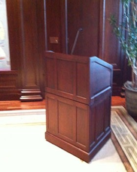 Custom boardroom lectern designed and finished to match the room's wainscotting