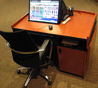 Room AV control desk.  Articulating monitor. 10RU of rack space. Document camera pullout shelf.