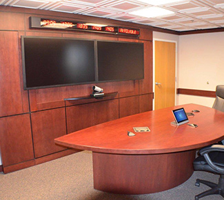 Air Force Base command conference room media wall with collaborative table