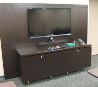 Media wall with equipment credenza in front