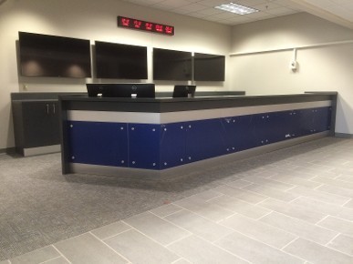 Duke Field Operations Center main control desk. Elevated floor.  Custom front treatment.  Rear storage and equipment credenza.